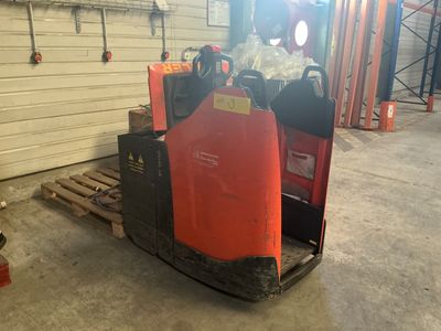 a forklift that is sitting in a garage