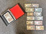 a lot of different types of paper money on the floor