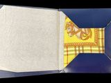 an open book with a yellow and blue design on it