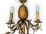 brass pineapple wall sconce with two candle holders