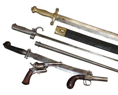 several different types of weapons are displayed on a white surface