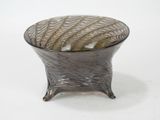 a glass bowl that is sitting on a table
