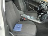 the interior of a car with the door open and the seats down