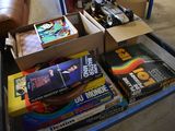 a lot of books on a table in the living room