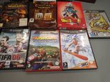 many video games on the table and one is for sale
