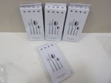 three boxes of silverware sitting on top of a white counter