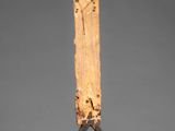 an image of a wooden sculpture of a man on a stand