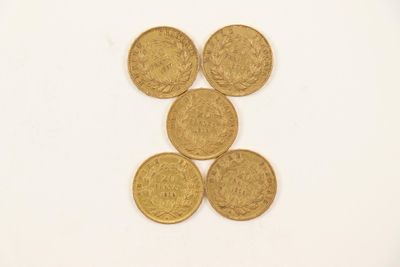 four gold coins are arranged in the shape of a number