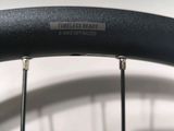 an image of a close up of a bicycle tire with a sticker on it