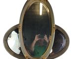 a man taking a picture of himself in a mirror