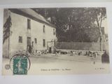 une photo d'une carte postale représentant une scène de vie à la ferme