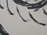 a black and white drawing of a woman ' s face on a wall