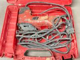 a red tool box with tools in it on a table