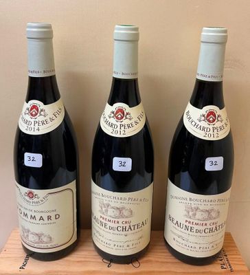 three bottles of wine sit on top of a wooden shelf