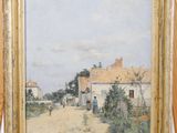 une image représentant un tableau posé sur un chevalet, sur lequel est représenté un village
