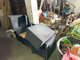 a lot of junk in a room with a television and other items