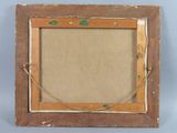 an old picture frame with a picture hanging on a wall