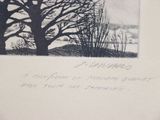 a black and white photo of a tree with a bird on it