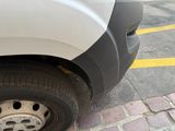 a white van that is parked on the side of the street