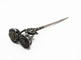 pair of antique silver plated scissors on a white background
