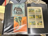 a book that is open to show pictures of elephants