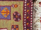 a close up view of a rug with fringes on it