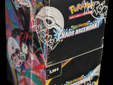 a box of pokemon trading cards on a black background