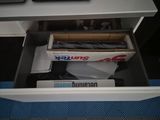 a drawer that has a lot of items inside of it