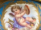 a picture of a picture of a cupid playing a musical instrument