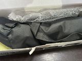 a box with a bag and a pair of shoes inside of it