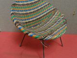 a colorful chair that is on a red carpet