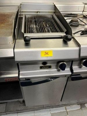 a grill that is sitting in the middle of a kitchen