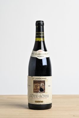a bottle of wine that is sitting on a table