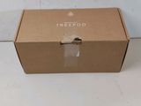 an open cardboard box sitting on top of a white table