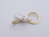 a gold keychain with a diamond ring on it