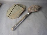 a wooden spatula and a metal spatula sitting on a table