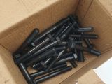 a box of screws in a cardboard box on a white surface