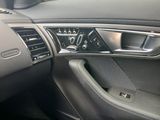 a car dashboard with a clock and a steering wheel