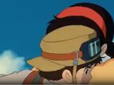 cartoon image of a woman with a hat and goggles looking at a cell phone