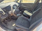 the interior of a car with a steering wheel and a dashboard