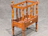 a small wooden magazine rack on the floor