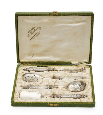 a green case with silverware in it on a white surface
