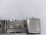 a close up of a metal buckle on a white surface
