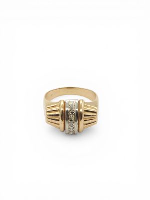 a yellow gold ring with a diamond set in the center