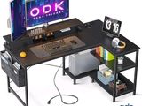a computer desk with a monitor, keyboard and mouse on it