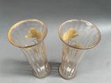 two vases that are sitting next to each other on a table