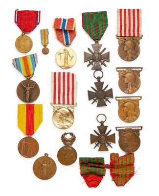 an assortment of medals and medals are displayed on a white surface