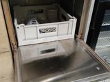 a dishwasher that is open in a kitchen