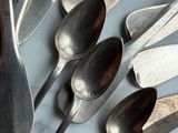a lot of spoons and spoon spoons on a table