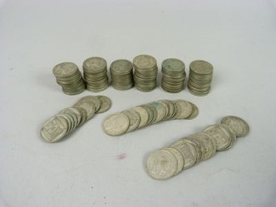 a lot of coins sitting on a white surface
